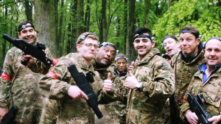 group of guys with laser tag gear